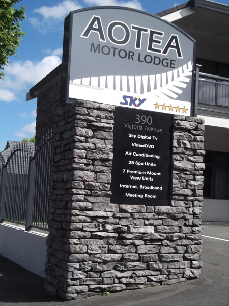 Illuminated monument sign for Aotea Motor Lodge on Victoria Avenue, Whanganui