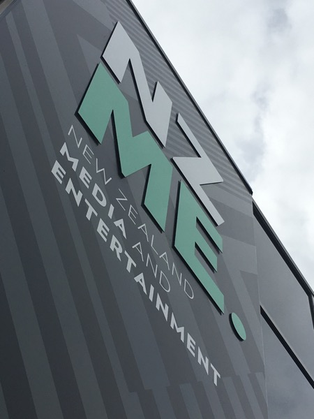 Large NZME building sign in raised three-dimensional lettering